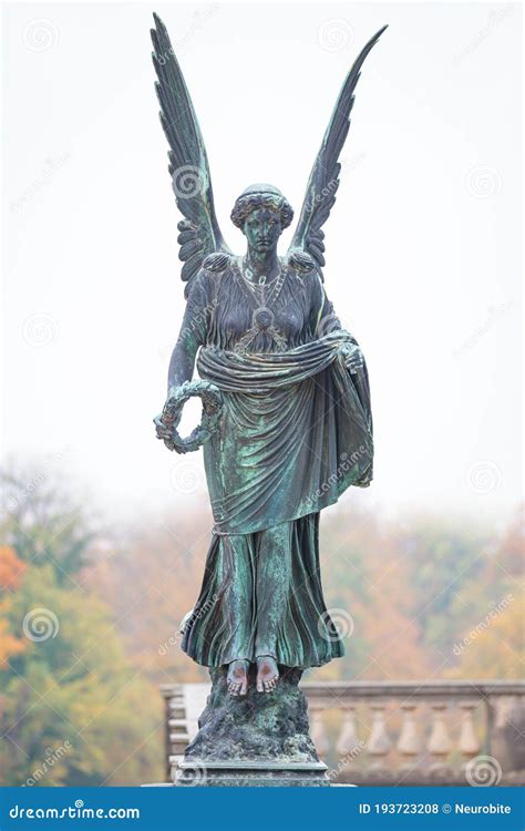 Statue Of Ancient Beautiful Winged Angel In Downtown Park Of Potsdam In