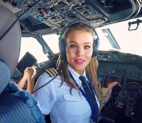 A Woman Pilot In The Cockpit Of An Airplane