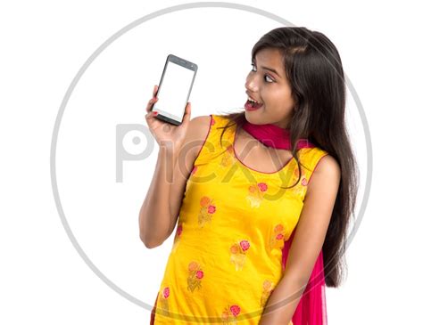 Image Of Young Indian Girl Or Woman Showing Smartphone Or Mobile Empty