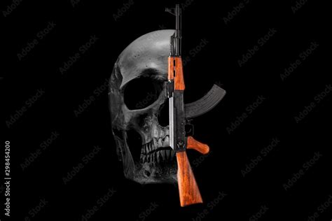 Skull And Assault Rifle Ak 47 On A Black Background War Crime Concept