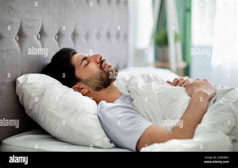 Deep Male Sleep Young Arab Guy Sleeping Peacefully In His Comfortable