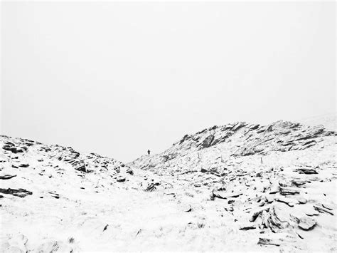 Mountain Mountain Covered With Snow Under White Sky White Image Free Photo