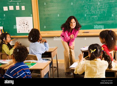 Female Teacher Asking Student A Question Stock Photo Alamy