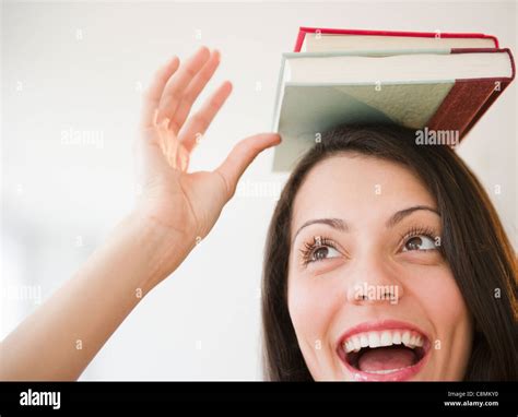 Woman Balancing Books Head Hi Res Stock Photography And Images Alamy