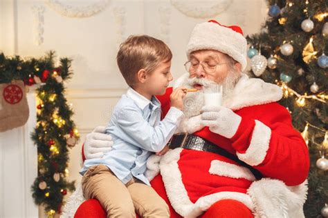 Santa Claus With Kids Indoors Christmas Celebration Concept Stock Image