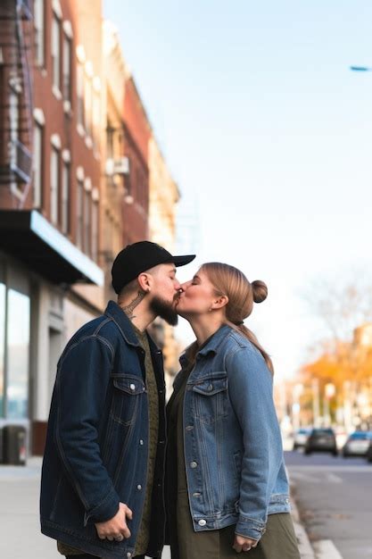 Premium Ai Image A Happy Couple Kissing While Out On A Morning Walk Together In The City