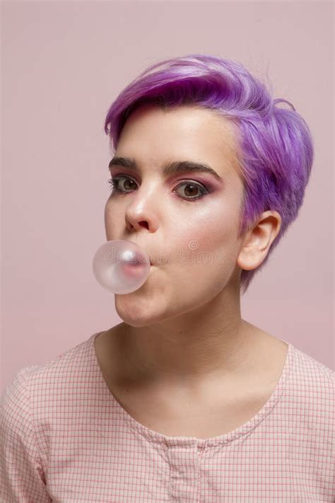 Violet Short Haired Girl In Pink Pastel Blowing A Bubble Gum Ba Stock