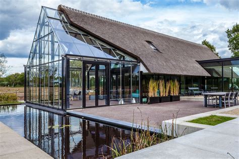 Cottage Meets Greenhouse In Modern Thatched Home Curbed