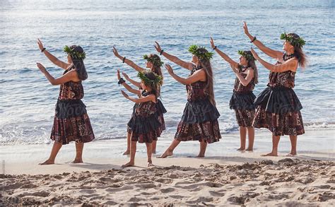 Group Of Traditional Hawaiian Hula Dancers Performing On The Beach In Maui By Stocksy