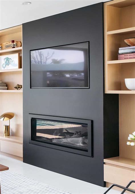 A Custom Designed Tv And Fireplace Wall Keeps Things Organized In This