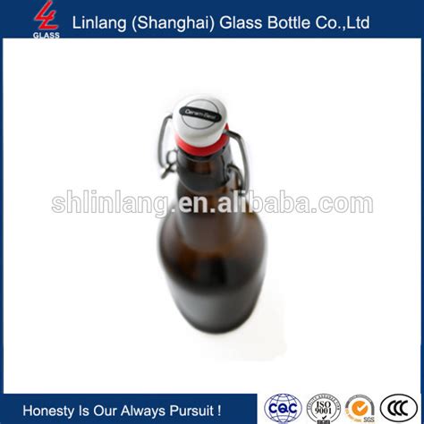 China Wholesale Estilo Swing Top Easy Cap Clear Glass Beer Bottles Round 16 Oz Manufacturer