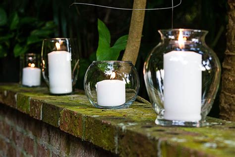 Large White Candles In Clear Glass Vases