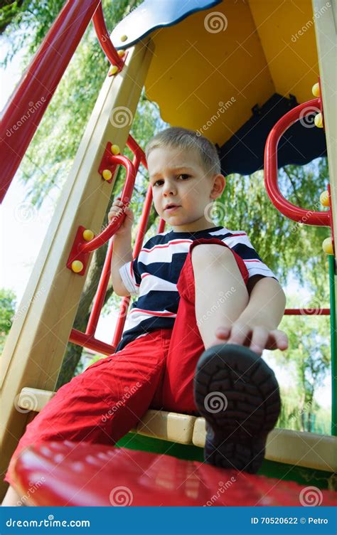 Serious Little Boy Sitting At Playground Stock Photo Image Of