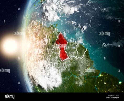 Satellite View Of Guyana Highlighted In Red On Planet Earth With Clouds