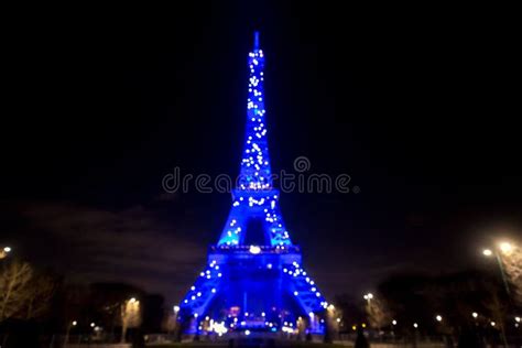 The Iconic Eiffel Tower Illuminated At Night In Paris France