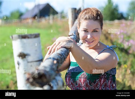 Attractive Village Woman In Sundress Posing Near Fence Russian People