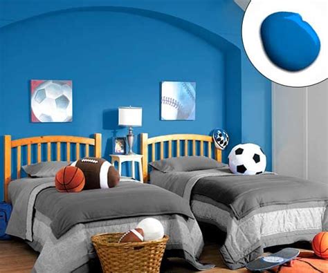 The brightness of this color makes the room feel bigger than it really is and abundant in natural light, even though the window is relatively small. A cobalt accent wall parallels sporty accessories in this ...