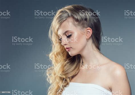 Young Nice Blonde Girl With Long Curly Fly Blonde Hair Woman Healthy Skin And Hairstyle Portrait