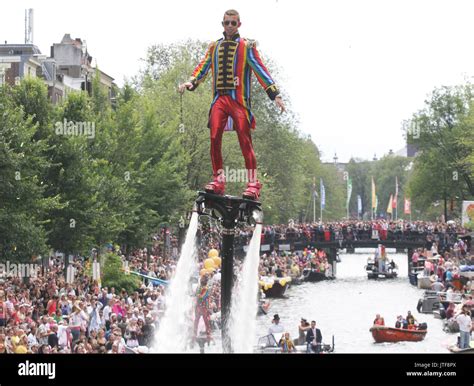 revelers on the boat in the prinsengracht canal participating in the amsterdam canal parade