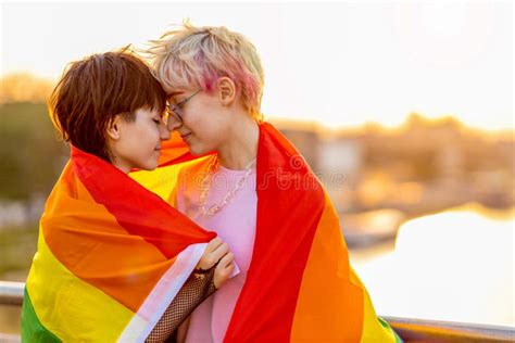 Portrait Of A Gender Fluid Person Wearing Rainbow Flag Stock Image