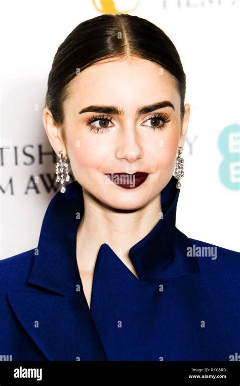 Lily Collins Poses Backstage At The British Academy Film Awards On