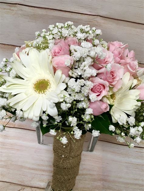 A Rustic Hand Tie Bouquet Using White Gerbera Daisies And Babies Breath
