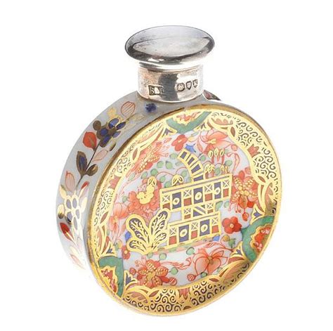 Circular Porcelain Perfume Bottle With Silver Top