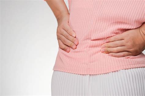 Back View Of Woman Suffering From Backache Waist Pain Muscle Or Chronic