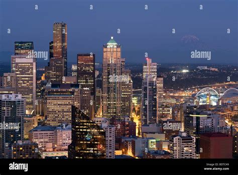 Seattle Skyline With Mount Rainier And Downtown Building At Sunset With