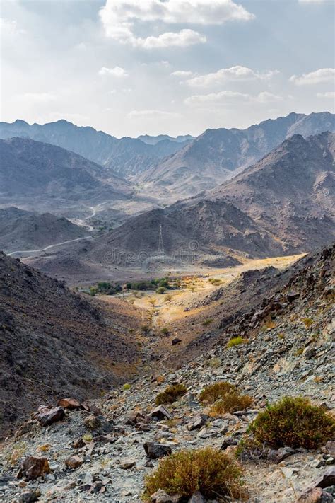 Hajar Mountains And Wadi Ghargur Landscape View With Transmission