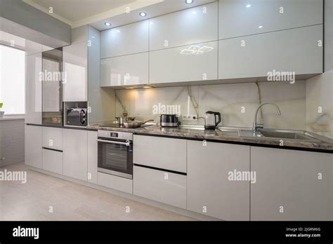 Interior Of Modern Trendy White Kitchen Stock Photo Alamy