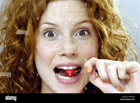 woman cherry nibble facial play caught portrait women s portrait redheads red haired