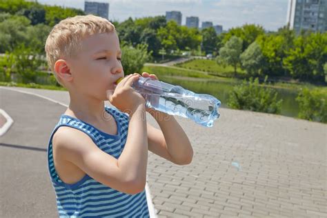 Child Drinking Pure Water In A Park Stock Photo Image Of Activity