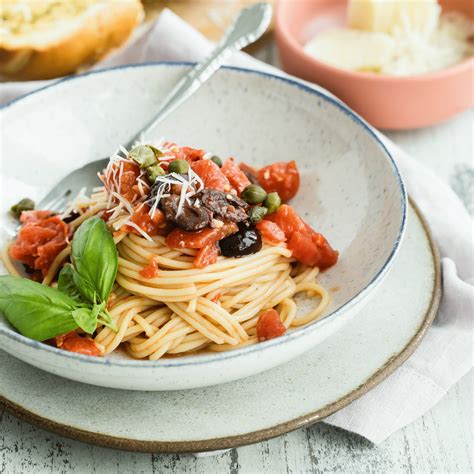 Spaghetti is a quick and easy dish that everyone loves. Spaghetti alla Puttanesca Recipe | Culinary Hill