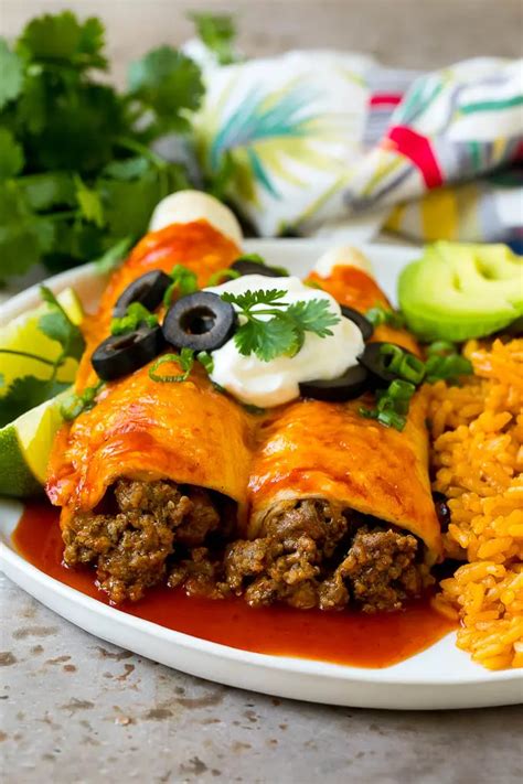 I used ground turkey instead of beef and pineapple salsa instead of enchilada sauce, but otherwise followed the recipe exactly. A plate of beef enchiladas topped with sour cream, olives ...