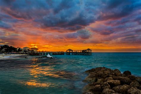 Sunset And Clouds Over Tropical Beach
