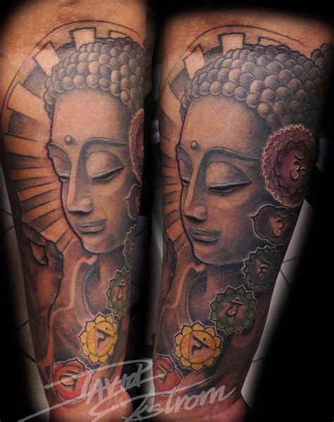 Two Buddhas With Flowers On Their Legs Are Shown In This Tattoo Design
