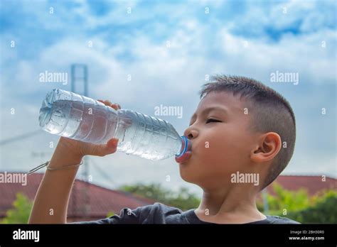 The Boys Are Drinking Cold Water Stock Photo Alamy
