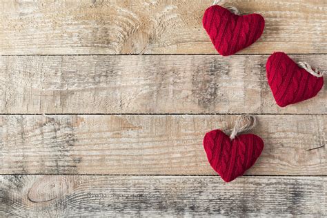 Stock Photo Three Knitted Red Hearts On Wooden Rustic Background For Valentine S Day Red