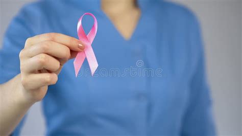 Doctor Showing Pink Ribbon Closeup Breast Anticancer Campaign