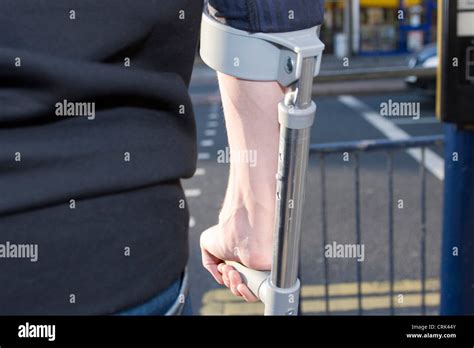 Man Walking On Crutches Stock Photo Alamy