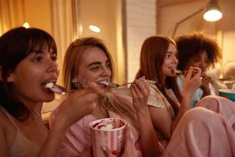 Girls Eat Ice Cream And Watch Tv Or Movie At Home Stock Image Image Of Leisure Multiracial