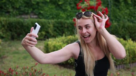 Blonde Woman Taking Selfies In The Park Video Stock Video Video Of