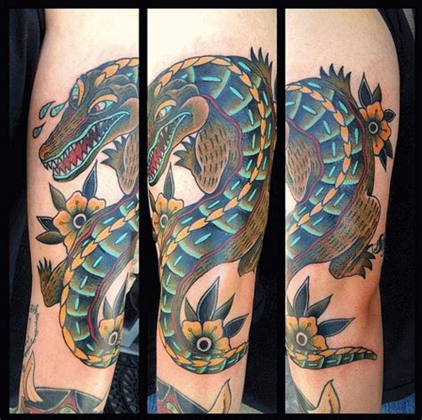 Crocodiles and alligators are both reptiles from the same order of animals, named crocodylia. Traditional Alligator Head Tattoo Design For Arm | Crocodile tattoo, Tattoo arm designs, Tattoos