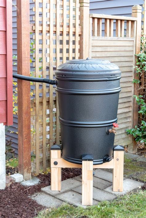Add a diy rain barrel to your home or garden. DIY Rain Barrel Stand | Rain barrel stand, Rain barrel, Rain barrel stand diy