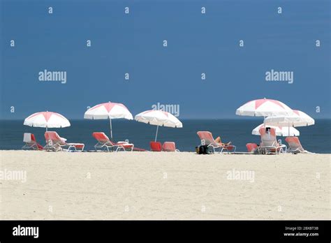 Beach Umbrellas Aligned For A Pretty Scene In Cape May New Jersey Usa
