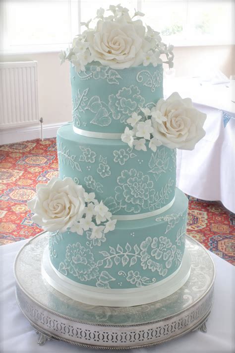 Turquoise Three Tier Wedding Cake With Brush Embroidery And Sugar Roses Tiered Wedding Cake