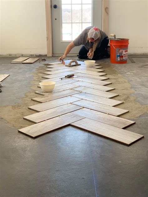 There's more to a tile floor than the tile itself; DIY Herringbone Tile Flooring in 2020 | Herringbone tile ...