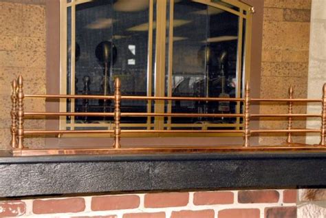 Portland Polished Copper Rail With Antique Copper Accent Grates And