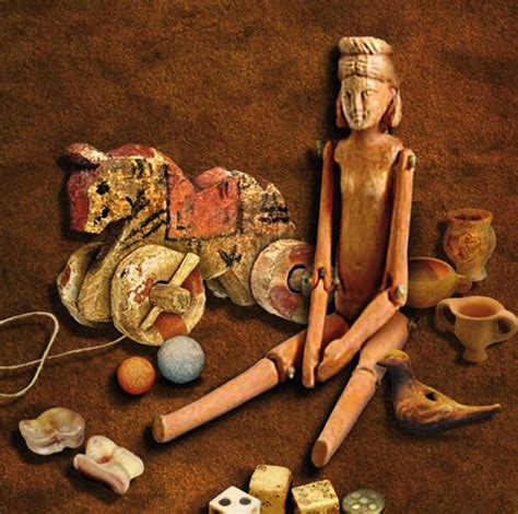 An Assortment Of Ancient Artifacts Including Clay Pottery And Other